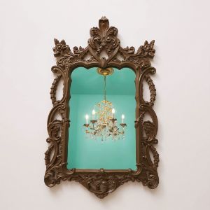 Ornate brown mirror. Resin